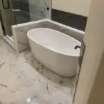 Alain’s bathtub in white color inside a bathroom